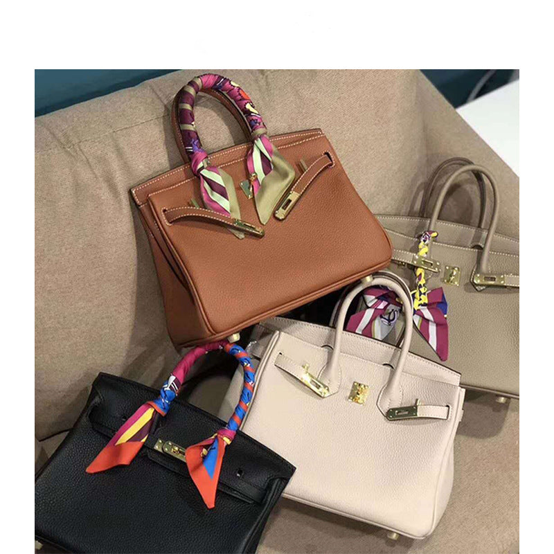 2025 H home platinum bag lychee pattern leather bag women's new first-layer cowhide fashion portable New Year's wedding bag