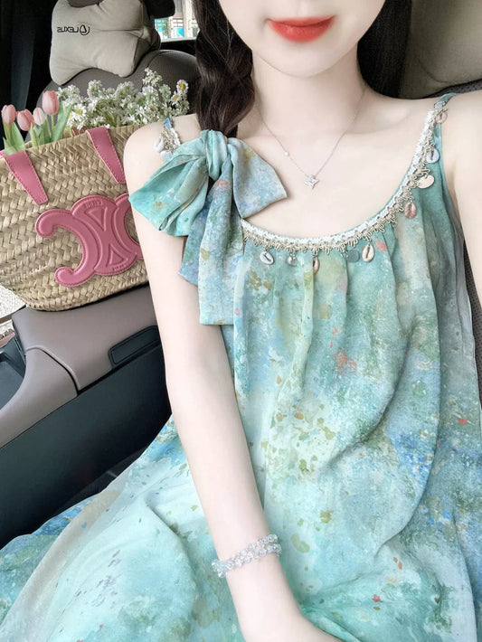 Li Buwan, legend of the sea, temperament seaside long skirt, smudged shell dress, loose suspenders, women's summer vacation